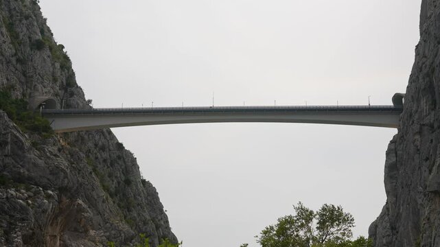 Modern high altitude bridge over mountain canyon.