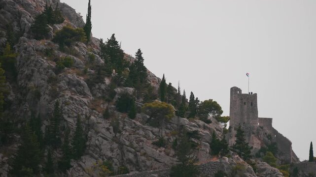 Ancient Mirabella fortress on steep mountain cliffs.