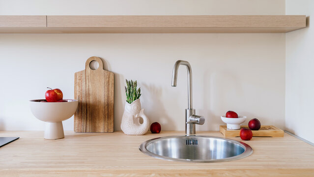 Modern minimalist kitchen counter with steel sink