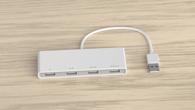 White USB hub with four ports on wooden desk