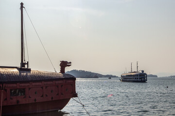 Traditional turtle ship docked at Tongyeong harbor in Namhae South Korea showcasing Korean naval heritage with wooden structure and dragon head. Scenic historic port and tourism landmark view. © humanaut