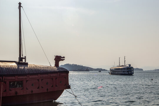 Traditional turtle ship docked at Tongyeong harbor in Namhae South Korea showcasing Korean naval heritage with wooden structure and dragon head. Scenic historic port and tourism landmark view.