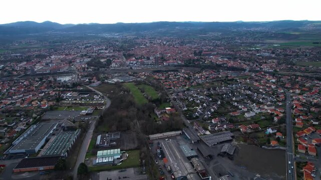 Aerial view around the old town of the city Riom, 63200 in France on a cloudy afternoon in early spring