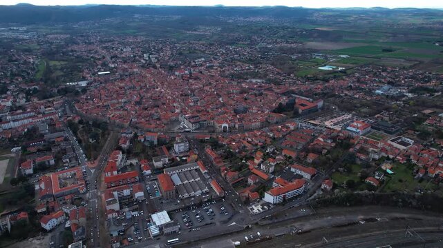 Aerial view around the old town of the city Riom, 63200 in France on a cloudy afternoon in early spring