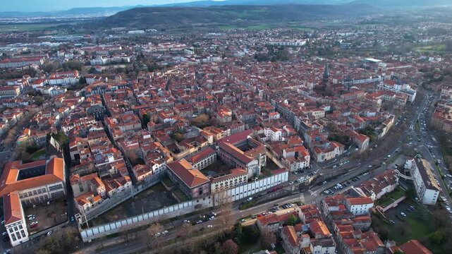 Aerial view around the old town of the city Riom, 63200 in France on a cloudy afternoon in early spring