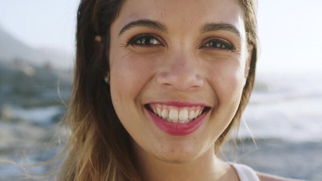 Holiday, face and girl with smile at beach for summer vacation, weekend getaway and ocean tourism. Happy, tourist or relax at seaside for travel adventure, fresh air or trip abroad on tropical island