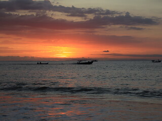 Fototapeta premium Serene Ocean View from Sandy Beach Shore tropical Beach at Sunset