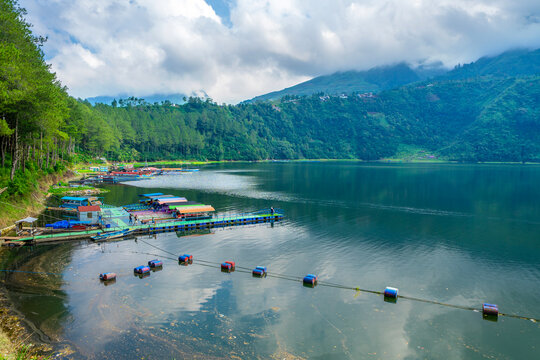 Menjer or Menjer Lake, located in Wonosobo,Central Java, Indonesia. Besides being a tourist attraction,this lake also functioned as a hydroelectric power plant or PLTA. Forest and lake in foggy.