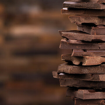 chocolate tower of dark chocolate bars, dessert food