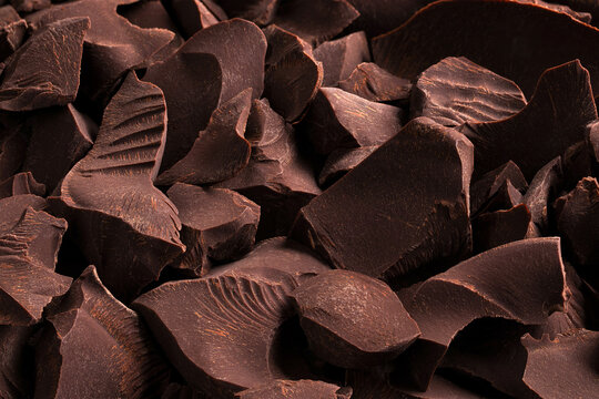 Pile of dark chocolate background. sweet dessert close-up.