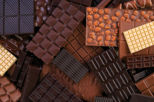 milk and dark chocolate bar, dessert food background.