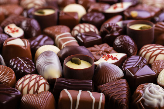 chocolate candy background, assorted sweetness, top view.