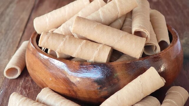 Golden rolled wafer cookies (a snack)