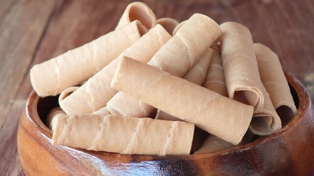 Golden rolled wafer cookies (a snack)