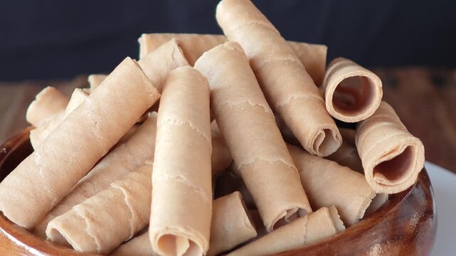 Golden rolled wafer cookies (a snack)