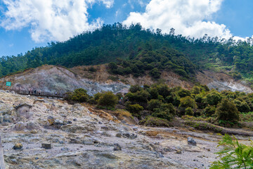 Fototapeta premium Sikidang Crater is a crater field on the Dieng Plateau in Central Java, Indonesia. It is located closest to the Dieng temple complex and is easily accessible and enjoyable due to its flat terrain.
