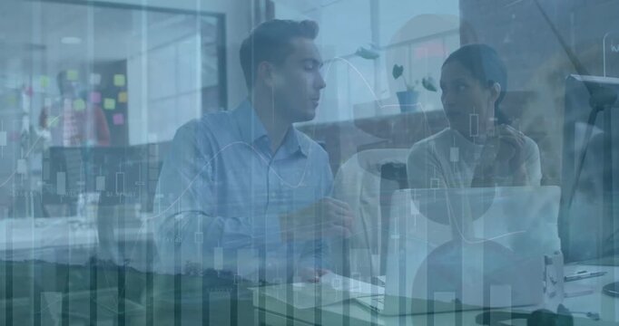 Male and female business colleagues discussing business in a modern office