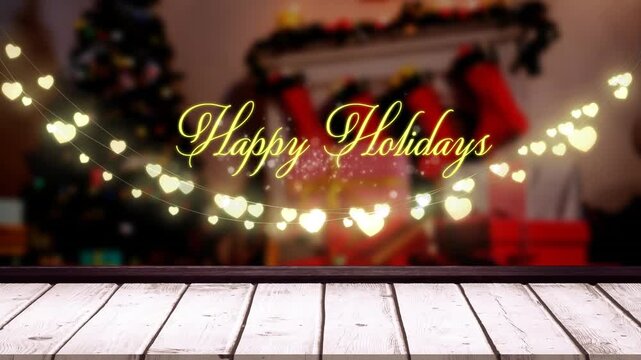 Animation of happy holidays text banner and hanging fairy lights against decorated christmas house