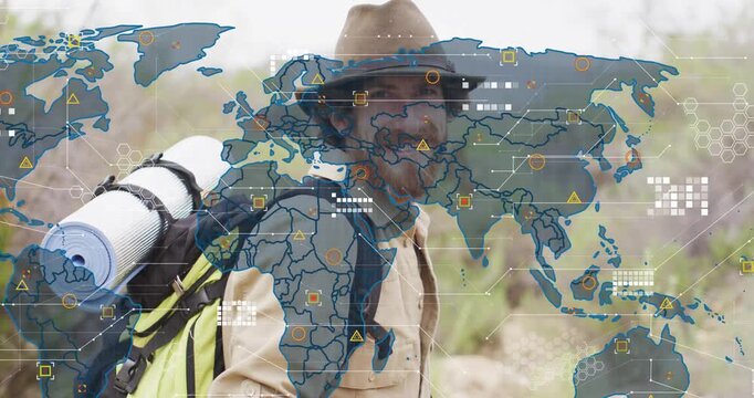 Hiker wearing pack looking right and activating AR map overlay while analyzing route data in desert