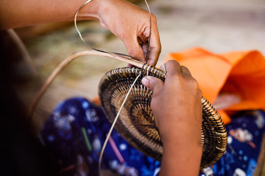 Hands of Indigenous Mangyan Woman Carefully Weaving a Traditional Basket from Bamboo Fibers in Mangyan Village, Talipanan, Puerto Galera, Oriental Mindoro, Philippines