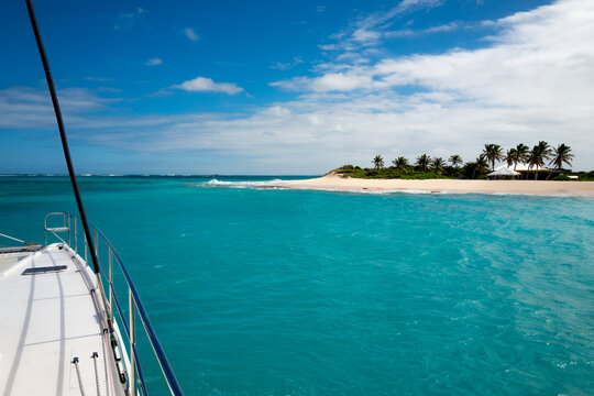 Views of the water and beaches on a catamaran sail boat on Sint Maarten island in the Caribbean Sea.