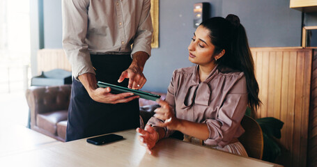 Fototapeta premium Woman, waiter and tablet with menu at cafe for order, customer experience and choice at restaurant. People, tech and application for digital price list, service or decision with guide at coffee shop