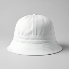 Fototapeta premium White bucket hat with wide brim and button on top for casual wear