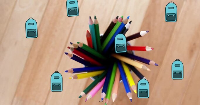 Animation of backpack icons over pencils in container on wooden background