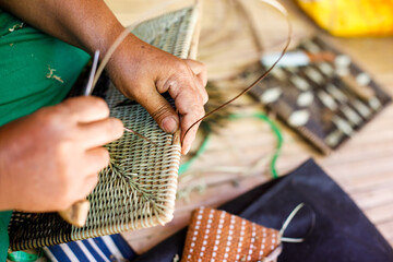 Hands of Indigenous Mangyan Woman Carefully Weaving a Traditional Basket from Bamboo Fibers in Mangyan Village, Talipanan, Puerto Galera, Oriental Mindoro, Philippines