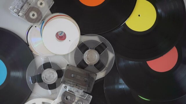 Vinyl records, audio cassettes, tape reels, and CDs
