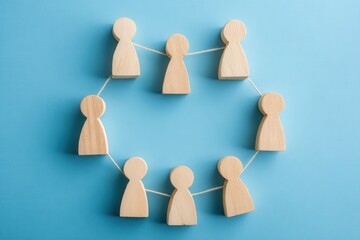 Obraz premium Connected Circle: A symbolic representation of interconnectedness and collaboration, with wooden figures forming a seamless circle, emphasizing unity and shared purpose.