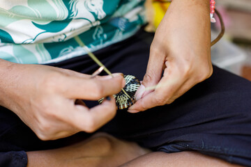 Hands of Indigenous Mangyan Woman Carefully Weaving a Traditional Basket from Bamboo Fibers in Mangyan Village, Talipanan, Puerto Galera, Oriental Mindoro, Philippines