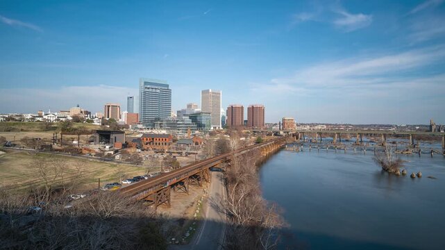 Richmond, Virginia skyline and James River from a high overlook, featuring moving clouds and the urban landscape. Elevated wide-angle 4k long exposure timelapse.