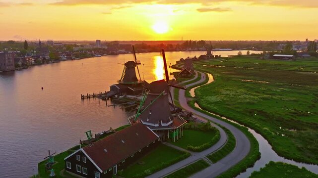 Aerial view of windmills at famous tourist site Zaanse Schans in Holland on sunset. Zaandam, Netherlands