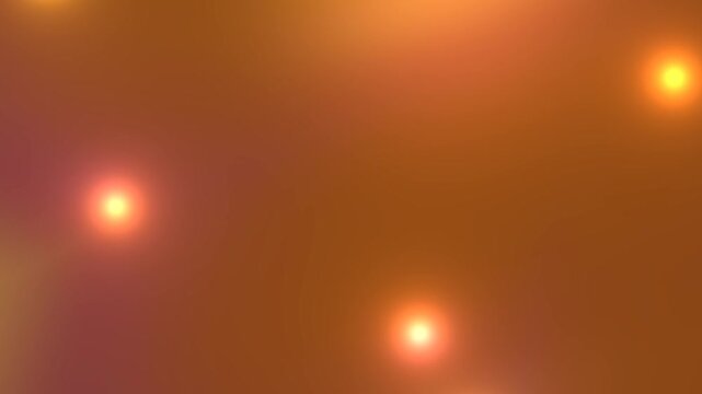 Warm orange abstract gradient animation with glowing light particles creating cinematic modern background.
