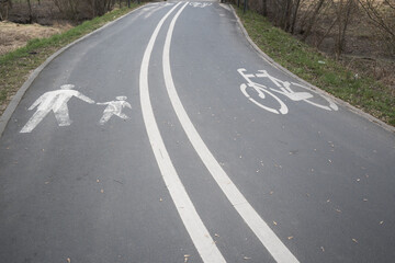 Naklejka premium Road marking with separated pedestrian and bicycle lanes.