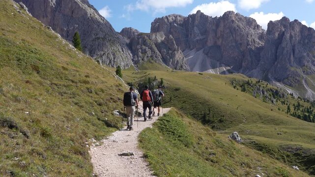 Hikers on a hike in Puez - Odle National Park. Italy. Dolomites.