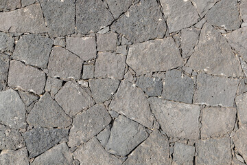 Obraz premium historic seamless volcano stone wall in grey as background