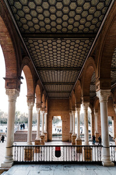 Spain Square, Plaza de Espana, Seville, Spain. View from porch between arches and columns. Central building.