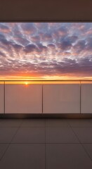 Fototapeta premium Sunrise over clouds viewed from a modern balcony with glass railing and tiled floor, golden hour light illuminating the sky.