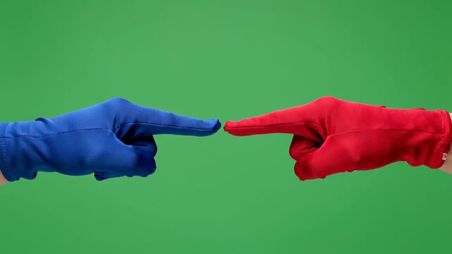 Two hands pointing at each other, blue and red, green screen background, conflict concept