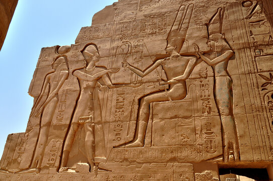 Ancient Egyptian Bas-Relief Wall Carving Depicting Pharaoh Making Offering to Seated Deity at Kom Ombo Temple
