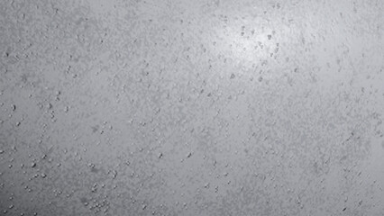 Fototapeta premium A close up view of a textured light grey surface covered in small scattered water droplets rain