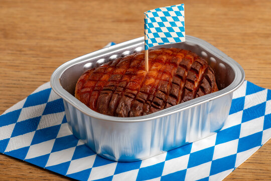 baked bavarian leberkaese on light wood