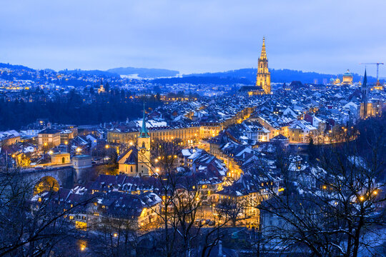 Old twon of Bern in winter blue hour with snowy and illuminated buildings, Rosengarten, Bern, UNESCO, Switzerland