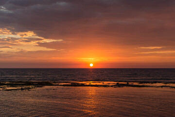 Fototapeta premium Golden sunset in Caboangan Beach in Pangasinan, Philippines.
