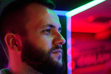 Bearded Man Profile Portrait With Neon Lights and Colorful Urban Lighting Ambience © .shock