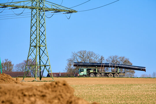 Large pipeline construction site in Ludwigsburg district, Baden-W&uuml;rttemberg, Germany. Workers and machinery install underground pipes for future gas and hydrogen energy supply across agricultural land