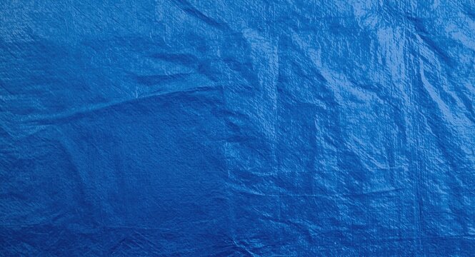 Rugged blue tarp with textured polyethylene protective layers