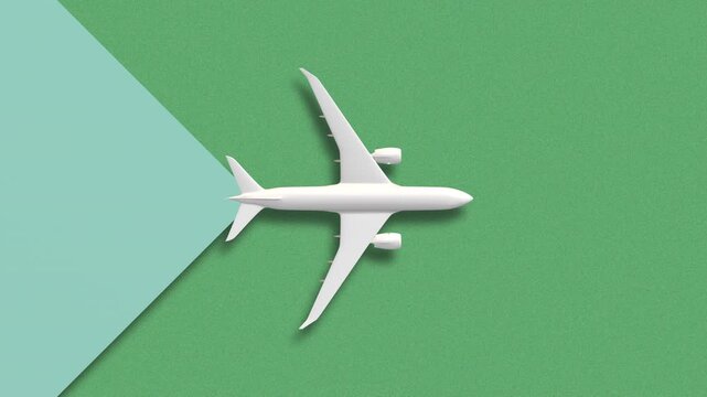 Top view white plane on green background transition